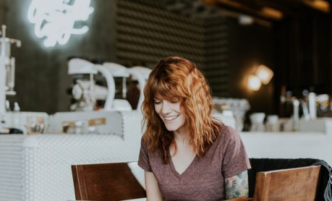 woman working on her laptop in a breakfast bar