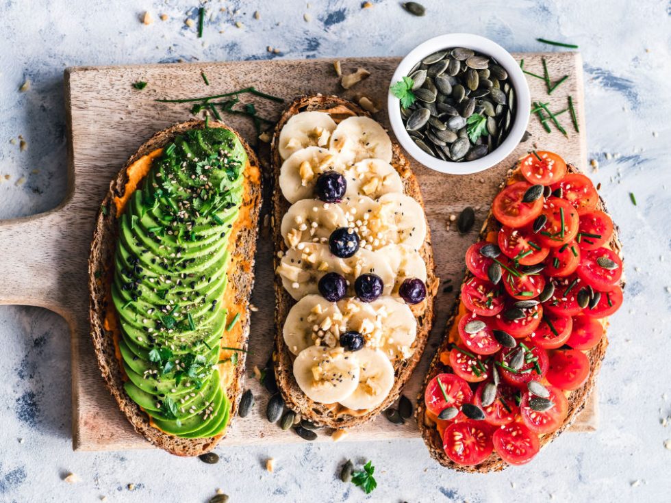 Three open-faced vegan sandwiches.